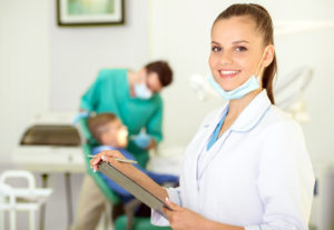Family Dentist Morrisville NC- woman dentist holding a clipboard 