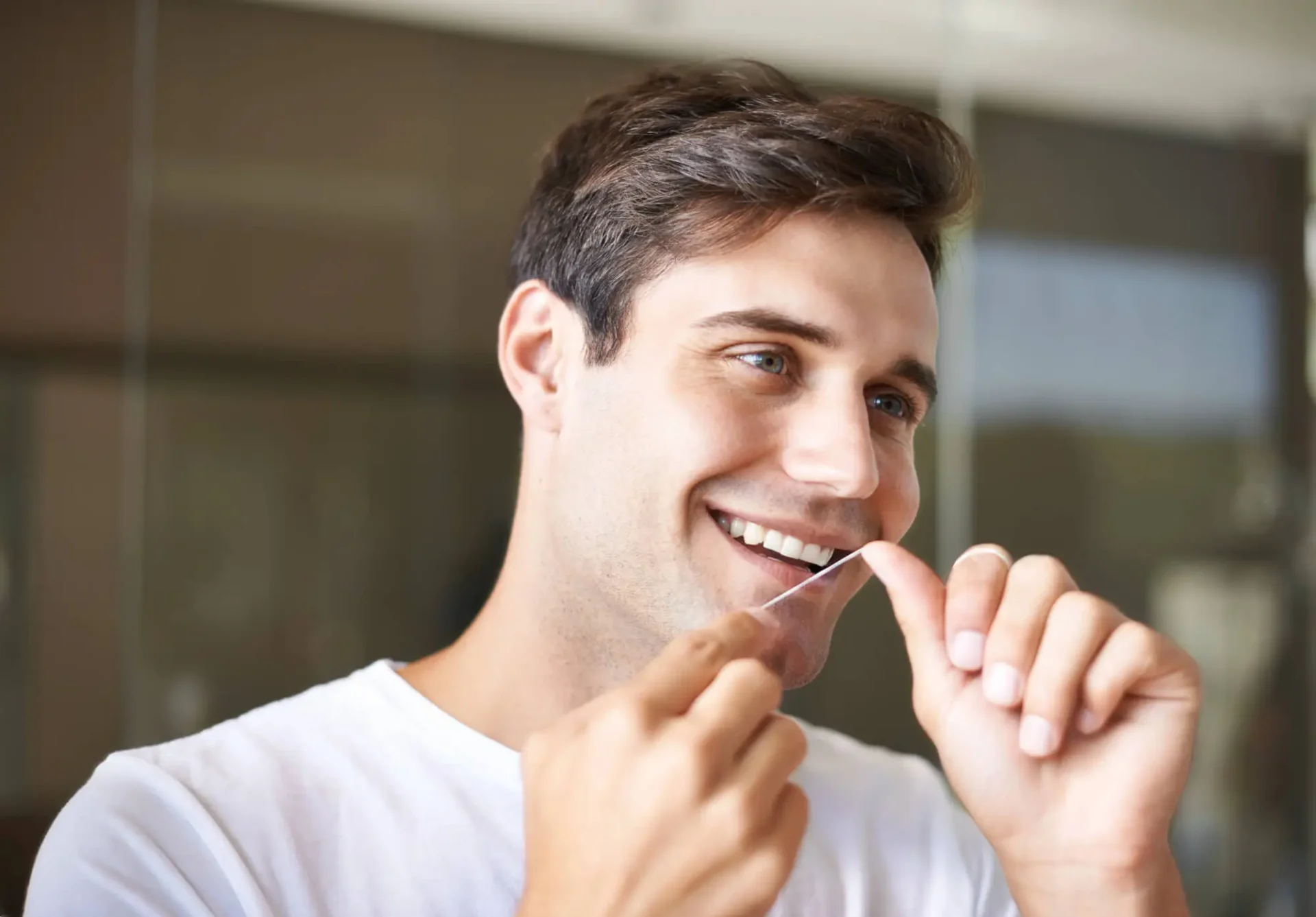 Flossing-Around-Dental-Crowns-in-Cary-NC