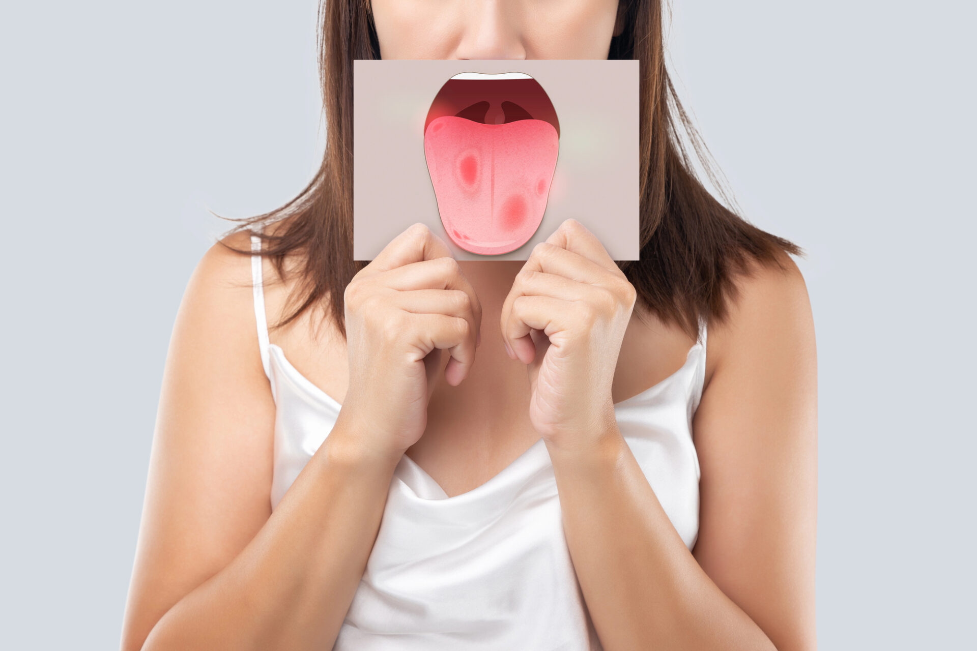 woman with picture of oral cancer at the dentist in Morrisville